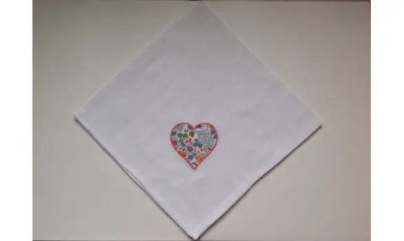 Embroidered swaddling heart